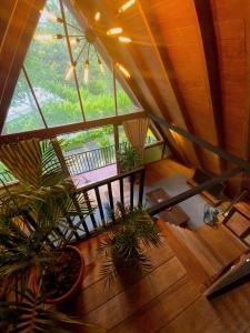 an overhead view of a room with plants at Comfortable Wood House second floor and attic in Kuta Lombok