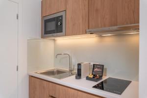 Kuchyň nebo kuchyňský kout v ubytování Ninemia Luxury Residence