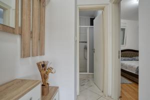 a room with a bedroom with a bed and a bathroom at Apartmani Čukić Rafailovići in Budva +152 photos