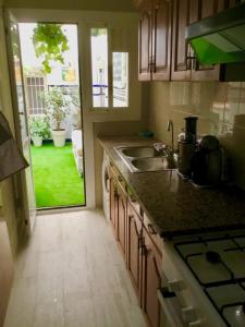 A kitchen or kitchenette at SITGES Apartment PALLARÉS