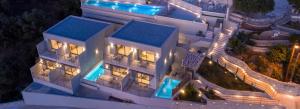 an aerial view of a building at night at Sivota Deamaris Luxury Boutique Hotel in Syvota