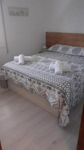 A bed or beds in a room at SITGES Apartment PALLARÉS