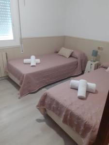 A bed or beds in a room at SITGES Apartment PALLARÉS