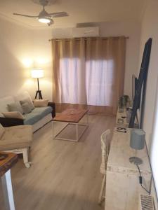 A television and/or entertainment centre at SITGES Apartment PALLARÉS