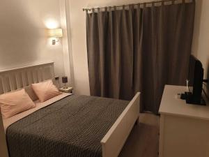 A bed or beds in a room at SITGES Apartment PALLARÉS