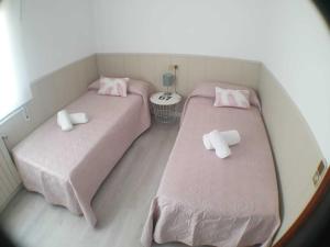 A bed or beds in a room at SITGES Apartment PALLARÉS
