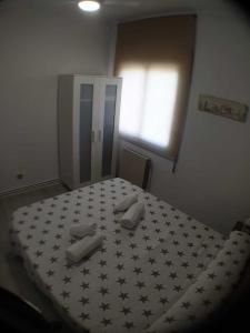 A bed or beds in a room at SITGES Apartment PALLARÉS