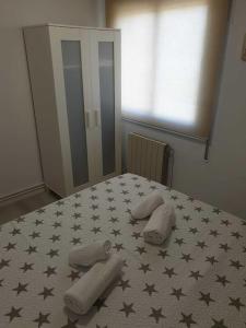 A bed or beds in a room at SITGES Apartment PALLARÉS