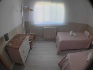 A bed or beds in a room at SITGES Apartment PALLARÉS