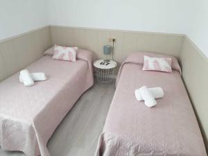 A bed or beds in a room at SITGES Apartment PALLARÉS