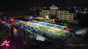 an aerial view of a city at night at Putra Brasmana Hotel in Kuala Perlis