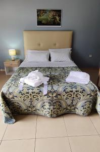 Posteľ alebo postele v izbe v ubytovaní Hospitable appartment in the central park, Xanthi