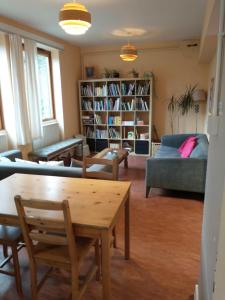 a living room with a couch and a table at South Downs Eco Lodge & Camping in East Meon