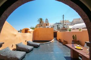a view of the patio from the roof of a house at Azalea Houses Cave Villa in Oia