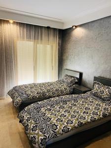 En eller flere senge i et værelse på luxury apartments