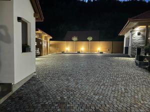 an empty driveway in a house at night at Relax House in Praid