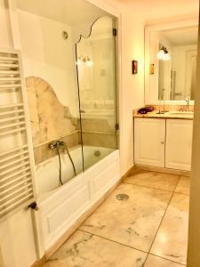 a bathroom with a shower and a bath tub at Stella Marina Stabia in Castellammare di Stabia