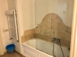 a bath tub in a bathroom with a glass door at Stella Marina Stabia in Castellammare di Stabia +31 photos