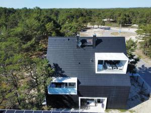 an overhead view of a house with a black roof at Hothel in Hel