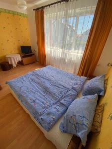 Postel nebo postele na pokoji v ubytování Willa Malwa