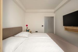 Ein Bett oder Betten in einem Zimmer der Unterkunft Hotel Delfin