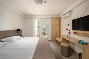Ein Bett oder Betten in einem Zimmer der Unterkunft Hotel Delfin