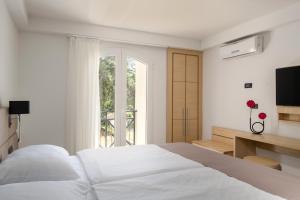 Ein Bett oder Betten in einem Zimmer der Unterkunft Hotel Delfin