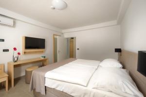 Ein Bett oder Betten in einem Zimmer der Unterkunft Hotel Delfin