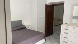 En eller flere senger på et rom på Casa Giardino