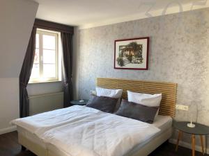 Postel nebo postele na pokoji v ubytování Rein Klassik Hotel