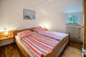 Postel nebo postele na pokoji v ubytování Nordsee Ferienwohnung Wattwurm