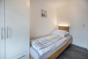 Ein Bett oder Betten in einem Zimmer der Unterkunft Ferienwohnung 9 und 40