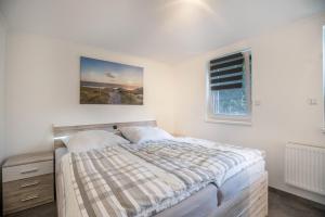 Ein Bett oder Betten in einem Zimmer der Unterkunft Ferienwohnung 9 und 40