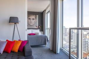a hotel room with a bed and a large window at Staying Cool At Rotunda in Birmingham
