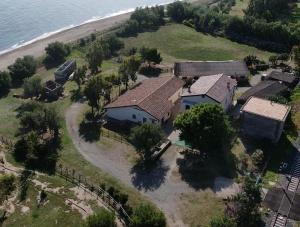 an aerial view of a house next to the beach at Residence Le Tamerici in Cariati