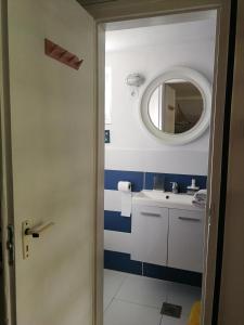 a bathroom with a sink and a mirror at Kis Vitorlás in Balatonmáriafürdő +17 photos