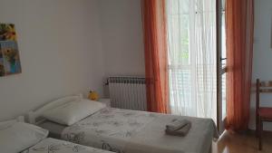 Postel nebo postele na pokoji v ubytování Accomodation Mirjana Rooms