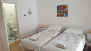 Postel nebo postele na pokoji v ubytování Accomodation Mirjana Rooms
