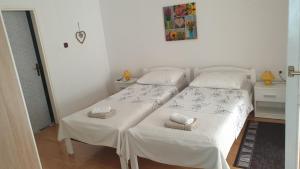 Postel nebo postele na pokoji v ubytování Accomodation Mirjana Rooms