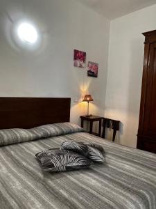 A bed or beds in a room at Agriturismo Corte San Girolamo