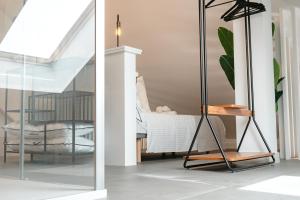 Posteľ alebo postele v izbe v ubytovaní APARTAMENTOS VIRGEN DEL CARMEN