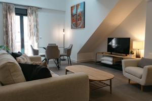 A seating area at APARTAMENTOS VIRGEN DEL CARMEN