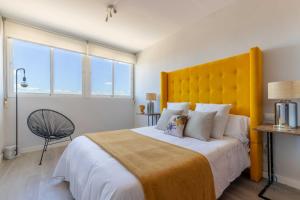 A bed or beds in a room at Living4Malaga Infinity Views Penthouse