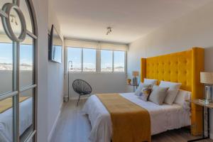 A bed or beds in a room at Living4Malaga Infinity Views Penthouse