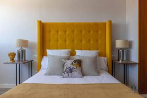 A bed or beds in a room at Living4Malaga Infinity Views Penthouse