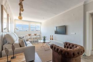 A television and/or entertainment centre at Living4Malaga Infinity Views Penthouse