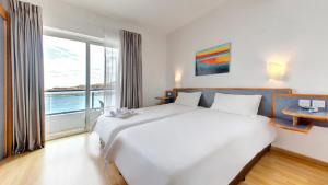 Postel nebo postele na pokoji v ubytování AX Sunny Coast Resort & Spa + 37 fotografií