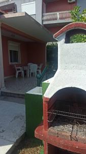 a brick fire place in the front of a house at Lemon Tree in Ulcinj