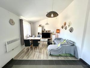 a bedroom with a bed and a table and a desk at Barbariga apartments in Vodnjan