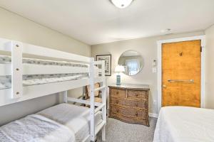 a bedroom with two bunk beds and a mirror at Wildwood Crest Apartment, half Mi to the Beach in Wildwood Crest
